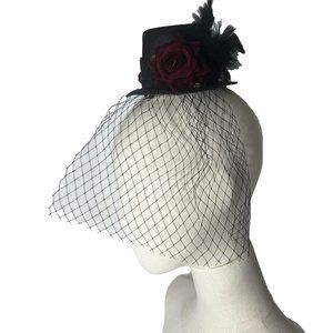 Tiny black satin hair top hat with net and red flower